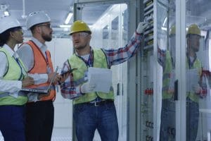 Group of men and woman in hardhats working